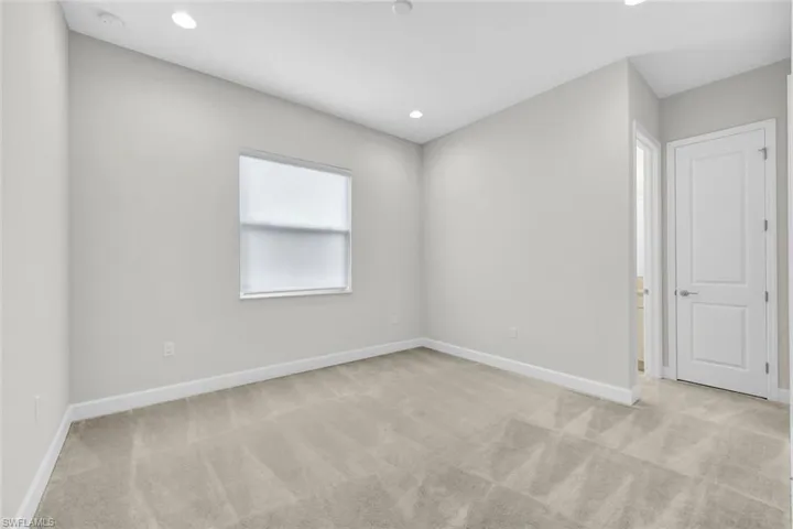 Second Floor Bedroom with light colored carpet