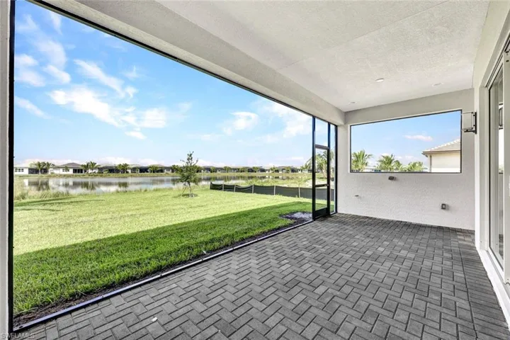 Unfurnished sunroom with a water view