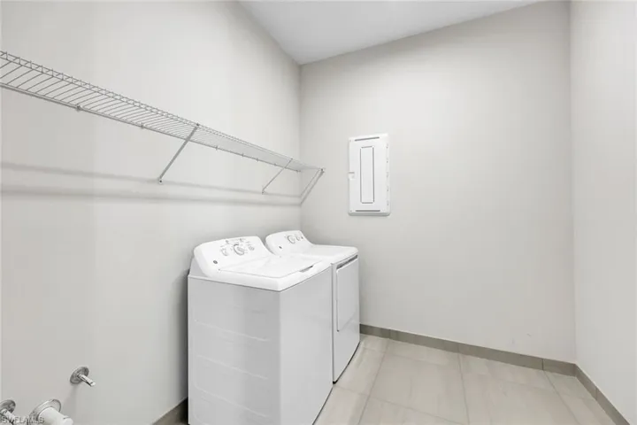 Clothes washing area with washing machine and clothes dryer