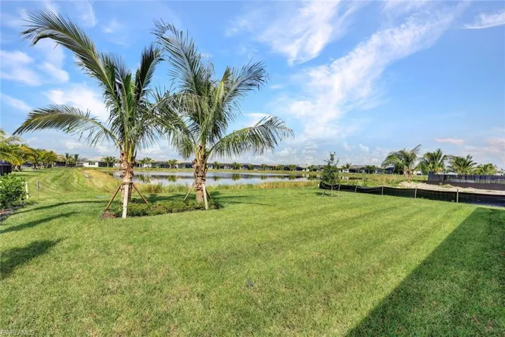 View of yard with a water view