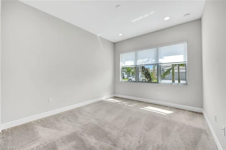 First Floor bedroom with light carpet