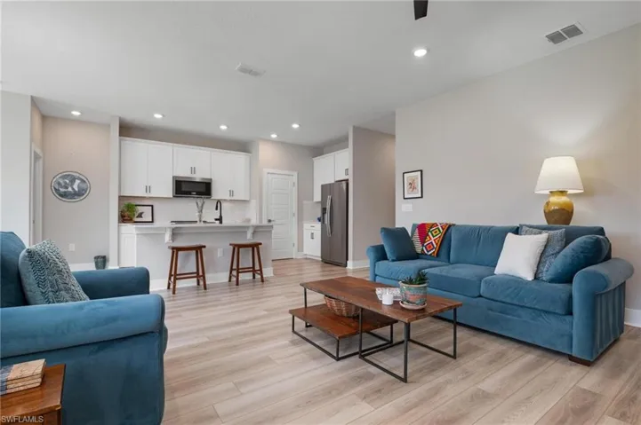 Living room with light hardwood / wood-style floors