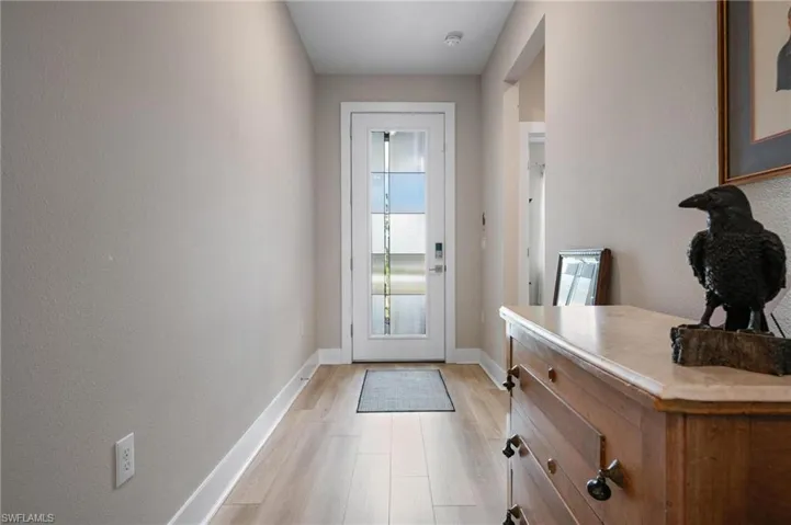 Doorway to outside featuring light wood-type flooring