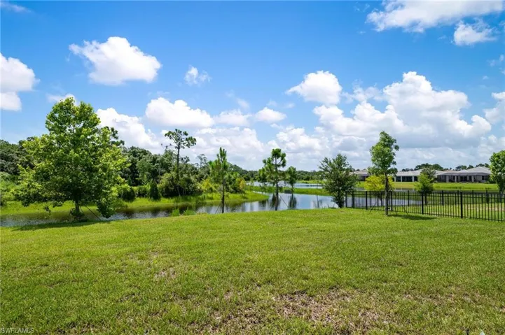 View of yard with a water view