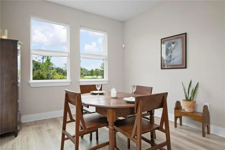 Dining space with light wood-type flooring