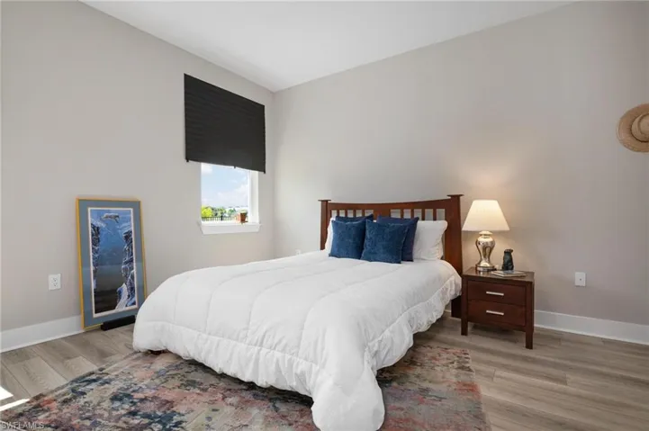 Bedroom with light hardwood / wood-style floors