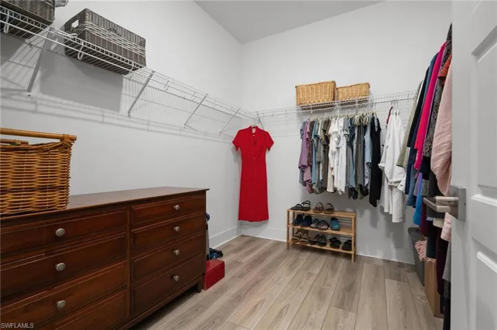 Walk in closet featuring light wood-type flooring