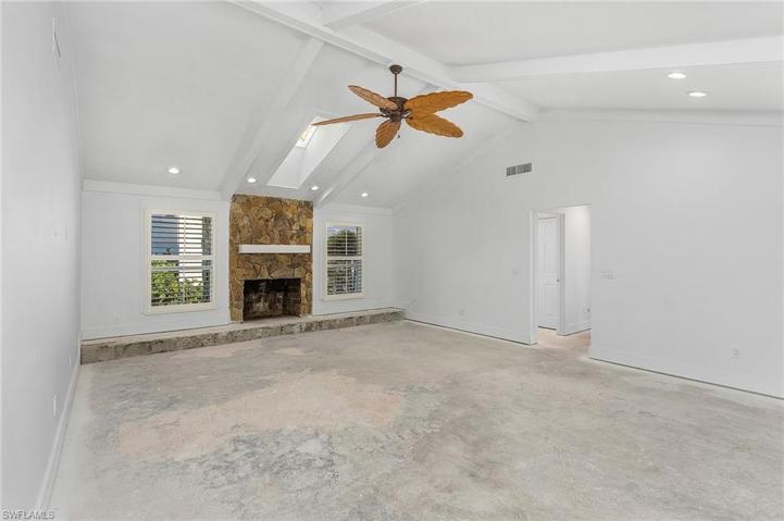 Family Room with fireplace and vaulted ceiling
