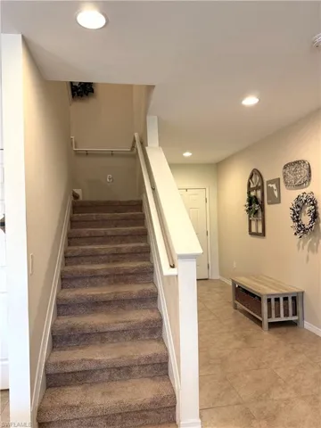 Staircase featuring tile patterned flooring