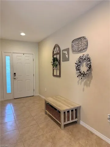Foyer featuring light tile patterned flooring