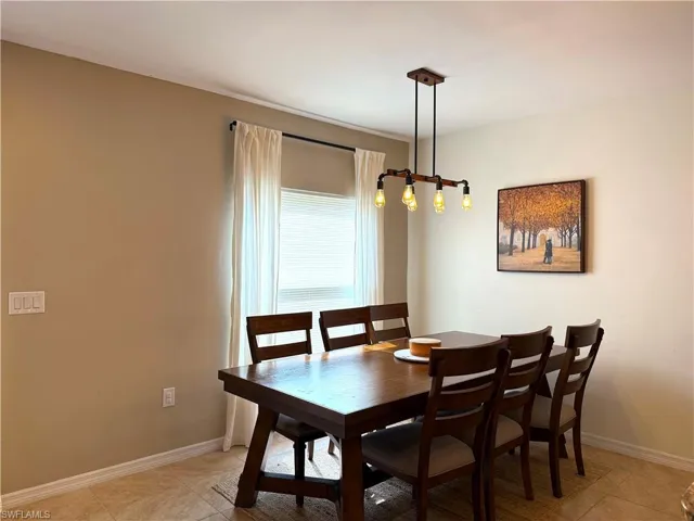 Dining room featuring light tile patterned flooring