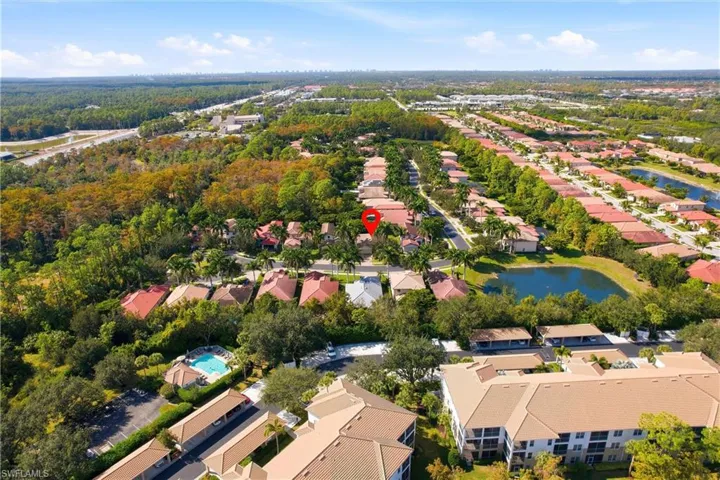 Aerial perspective of suburban area with a nearby body of water