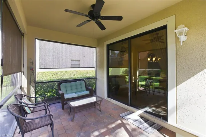 Sunroom / solarium featuring ceiling fan