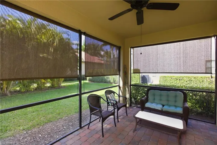 Sunroom / solarium with a ceiling fan