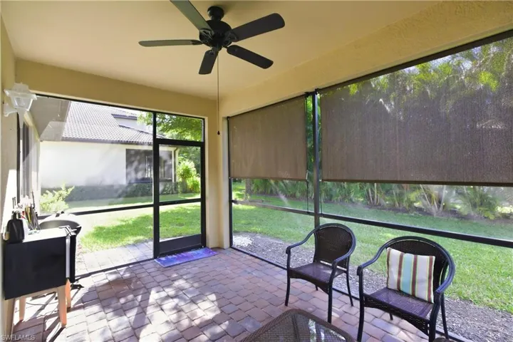 Sunroom featuring ceiling fan