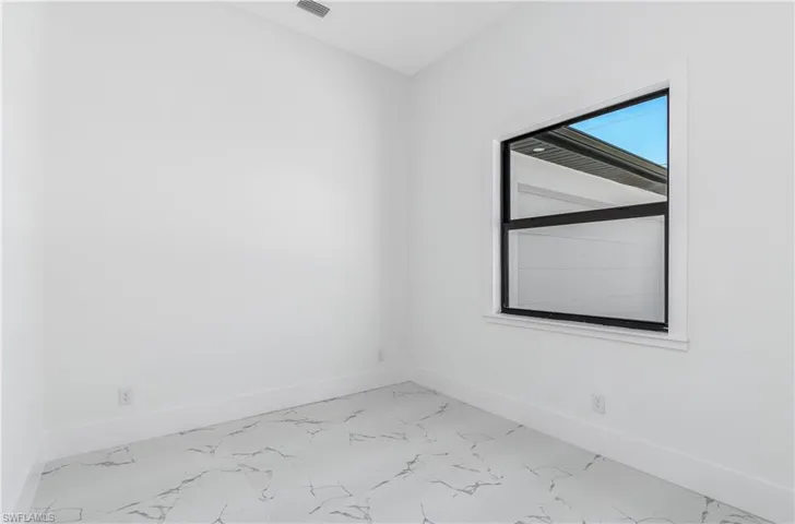 Unfurnished room featuring tile flooring