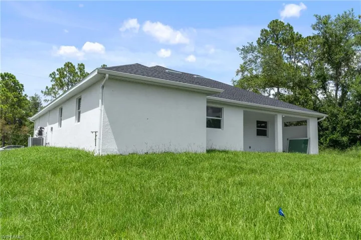 View of home's exterior featuring a yard