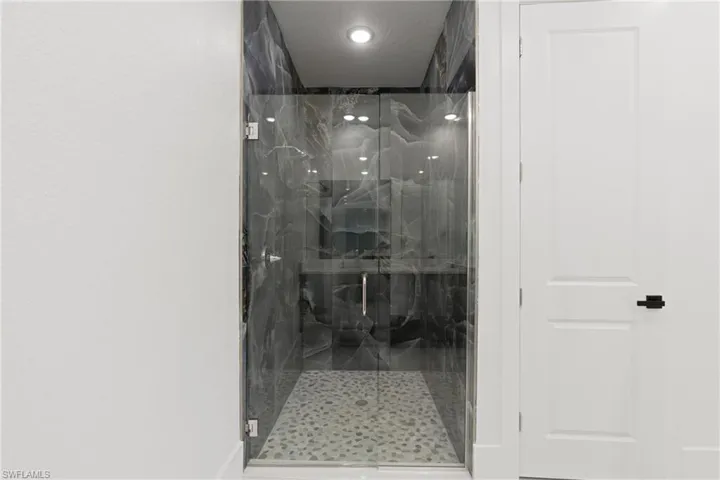 Bathroom featuring an enclosed shower