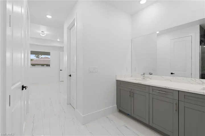 Bathroom featuring tile patterned flooring and vanity