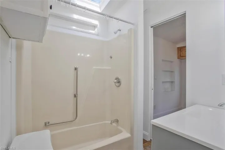 Full bathroom with vanity, toilet, and washtub / shower combination