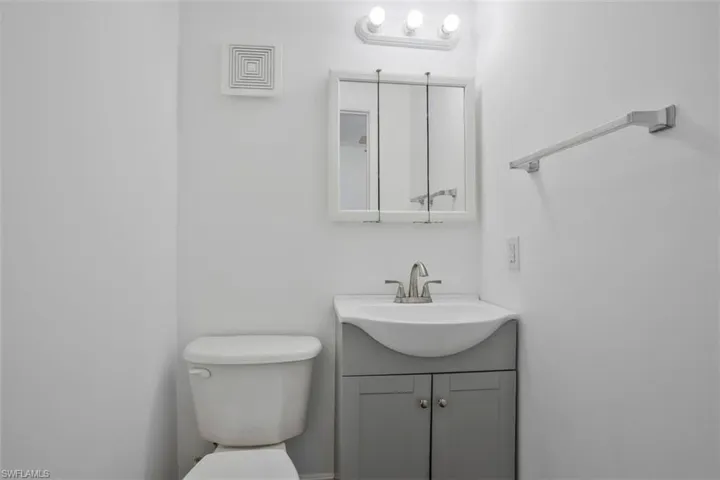 Bathroom with vanity and toilet
