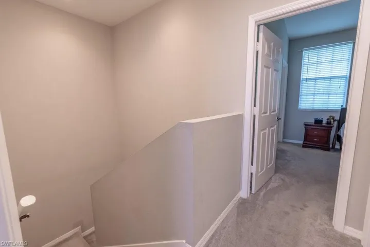 Corridor with carpet flooring