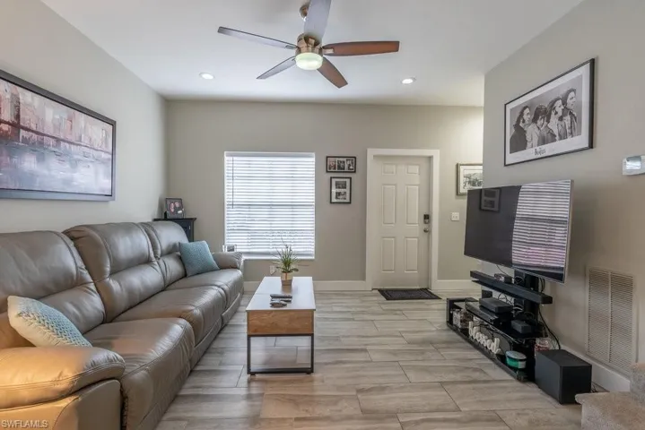 Living room featuring ceiling fan