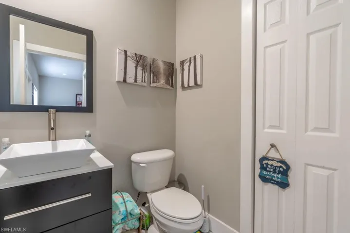 Bathroom featuring vanity and toilet