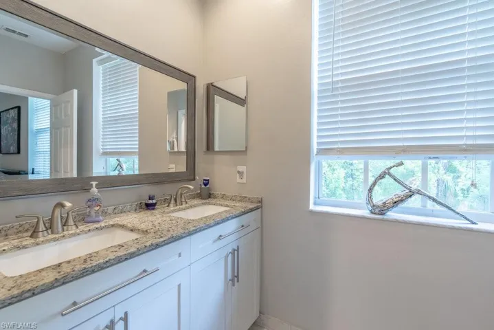 Bathroom featuring double vanity