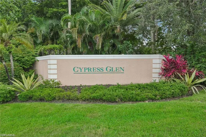 Community / neighborhood sign with a lawn