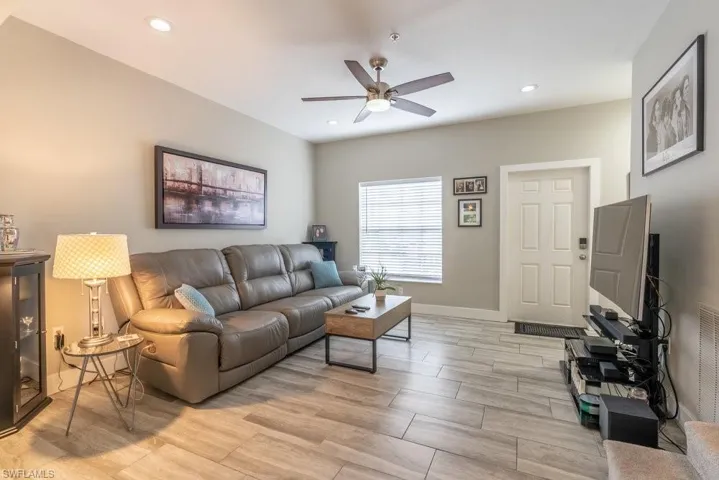 Living room featuring ceiling fan