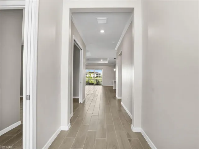 Hall with tile finished floors