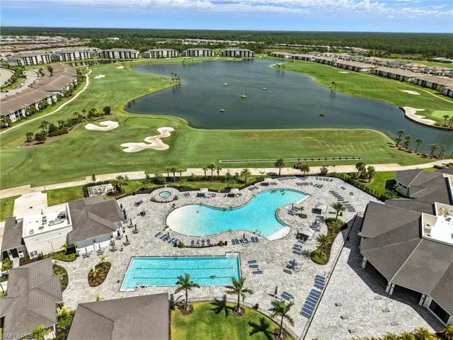Bird's eye view of pools and amenities plus golf course