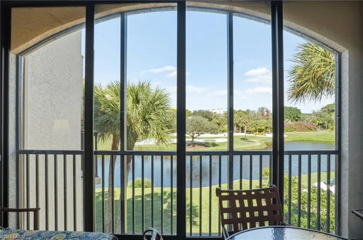 Sunroom / solarium featuring a water view and healthy amount of natural light