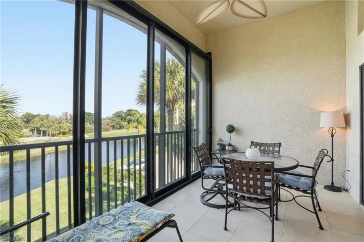Sunroom with a water view