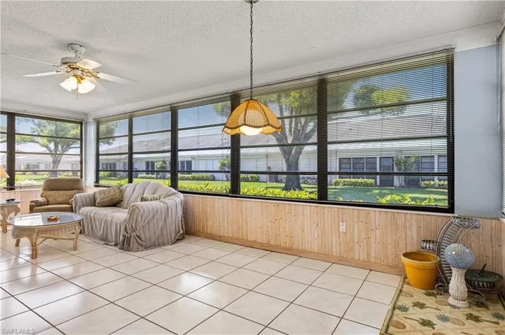 Sunroom featuring ceiling fan