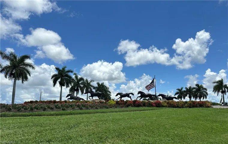 Another View of Lely Resort community Entrance with a yard
