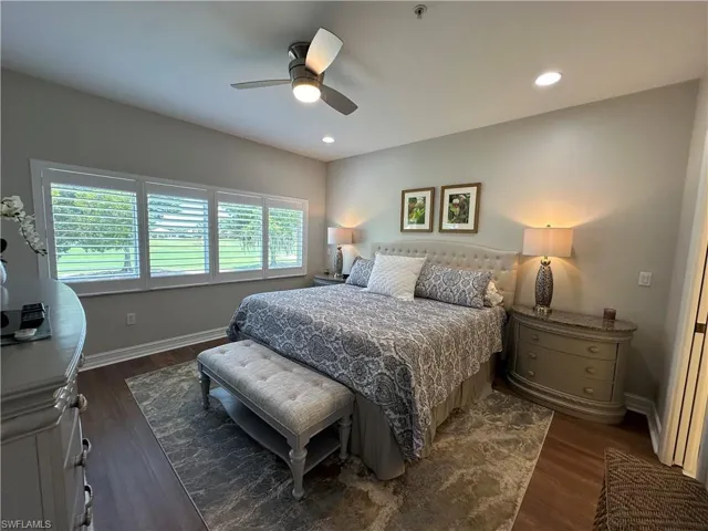 Master Bedroom featuring king size Bed with ceiling fan and dark wood-type flooring