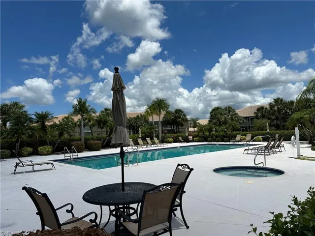 View of  Peridot at Sunstone's community pool with a patio and a hot tub