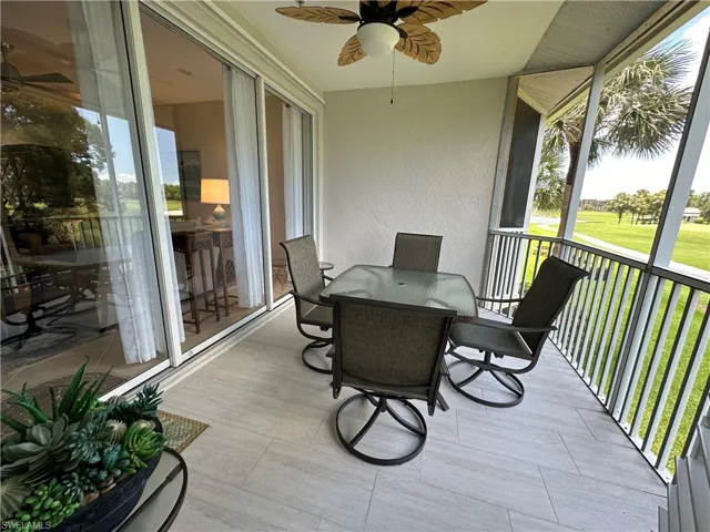 Sunroom / solarium featuring ceiling fan