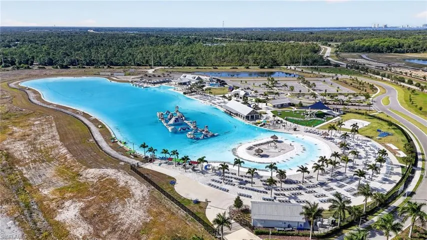 six acres of crystalline water, golden sands, swim-up bars, and stunning sunset views