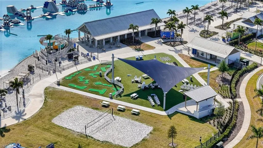 six acres of crystalline water, golden sands, swim-up bars, and stunning sunset views
