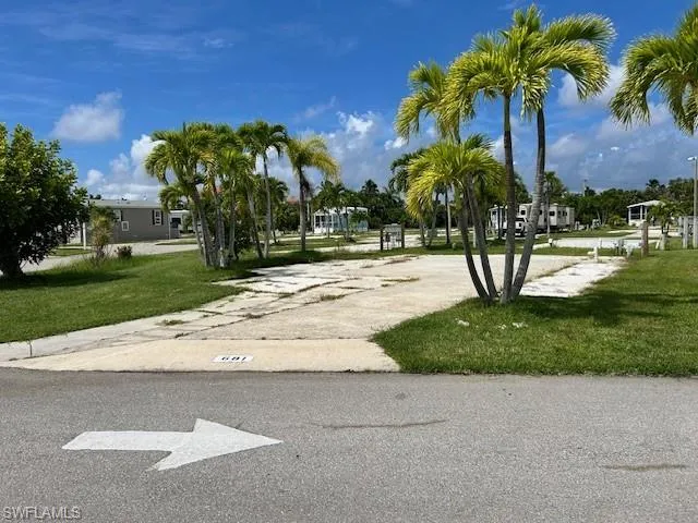 View of home's community with a lawn