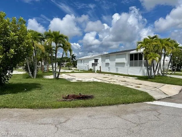View of property's community featuring a lawn