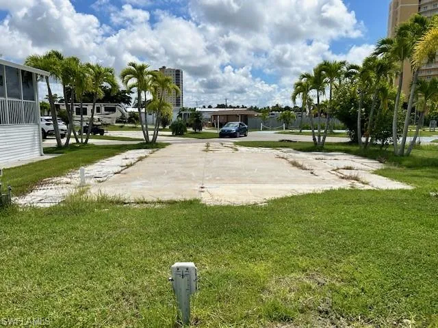 View of property's community with a yard
