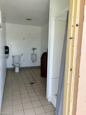 Bathroom featuring tile patterned flooring and toilet