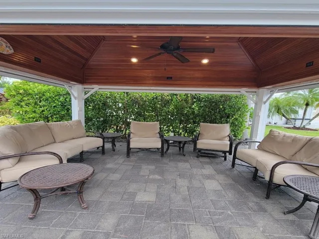 View of patio with a gazebo, ceiling fan, and outdoor lounge area