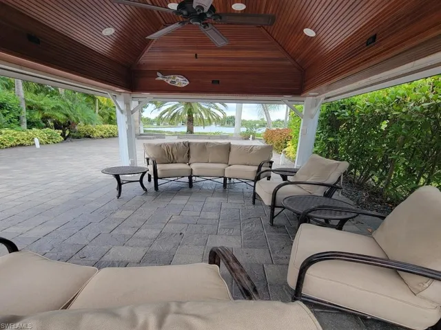 View of patio featuring an outdoor living space, a gazebo, and ceiling fan