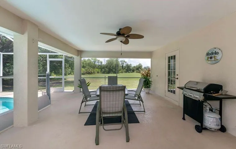 Sunroom featuring a healthy amount of sunlight and ceiling fan