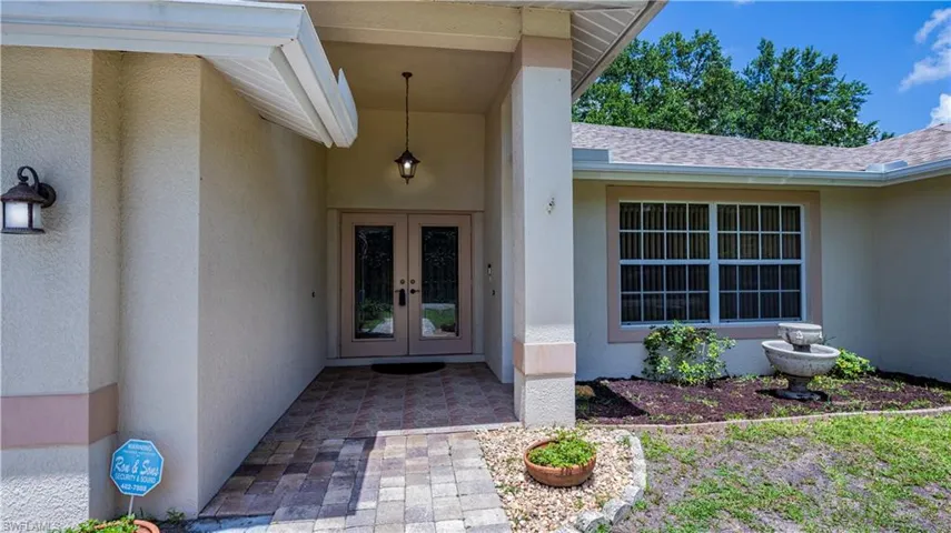Entrance to property featuring french doors